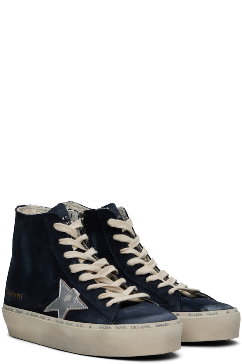 Handcrafted high-top suede sneakers in navy. Smudging throughout.

· Lace-up closure
· Logo embossed at tongue
· Perforated detailing at sides
· Zip closure at inner side
· Rubberized logo patch at inner side
· Signature star appliqué at outer side
· Logo stamp at outer side
· Terrycloth lining
· Logo and text printed at welt
· Treaded rubber sole

Supplier color: Blue/Silver