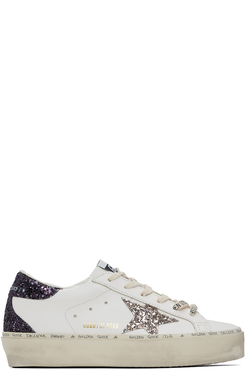 Handcrafted low-top buffed leather sneakers in white and purple.

· Logo printed at lace-up closure
· Logo patch at tongue
· Padded collar
· Glittered signature star appliqué at outer side
· Logo stamp at outer side
· Perforated detailing at sides
· Logo printed at glittered heel counter
· Suede, buffed leather, and terrycloth lining
· Logo and text printed at welt
· Treaded rubber sole

Supplier color: White/Cinder/Caberne