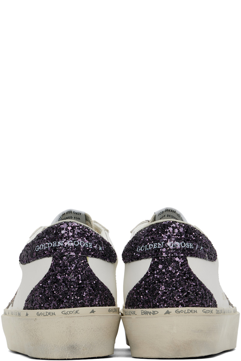 Handcrafted low-top buffed leather sneakers in white and purple.

· Logo printed at lace-up closure
· Logo patch at tongue
· Padded collar
· Glittered signature star appliqué at outer side
· Logo stamp at outer side
· Perforated detailing at sides
· Logo printed at glittered heel counter
· Suede, buffed leather, and terrycloth lining
· Logo and text printed at welt
· Treaded rubber sole

Supplier color: White/Cinder/Caberne