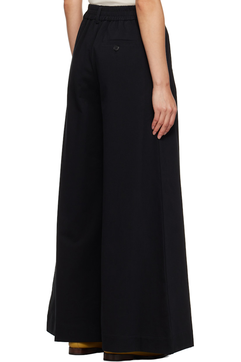 Wide-leg cotton twill trousers.

· Belt loops at partially elasticized waistband 
· Three-pocket styling 
· Zip-fly

Supplier color: Black
