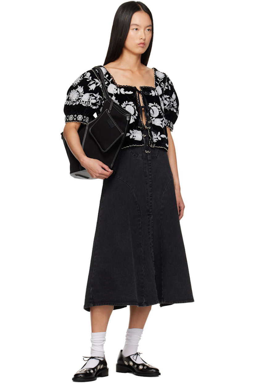 Non-stretch denim midi skirt. 

· Paneled construction
· Central vent at front hem 
· Zip closure at back waistband

Supplier color: Black