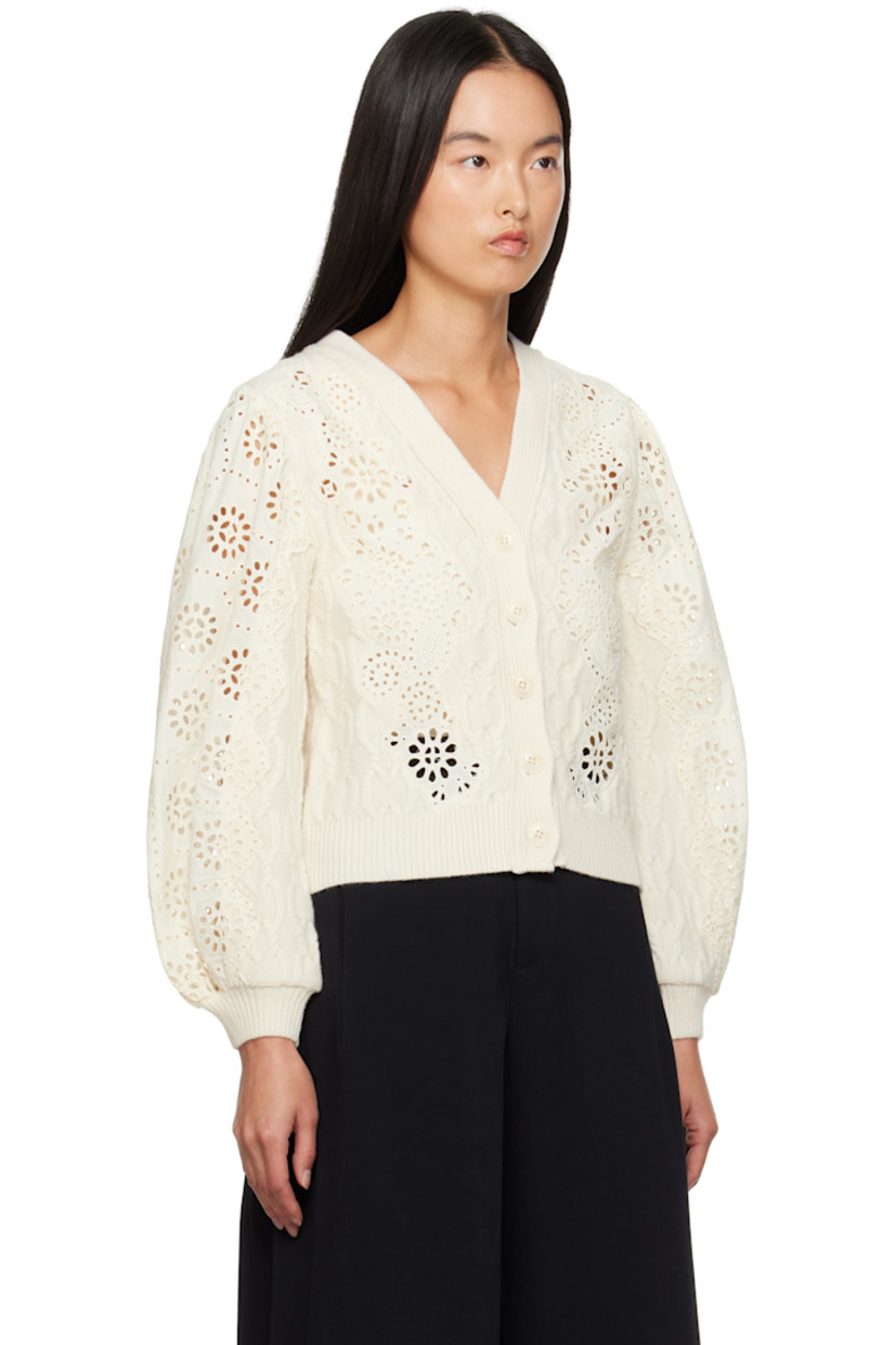 Relaxed-fit knit wool and cotton cardigan. Broderie anglaise detailing throughout.

· Rib-knit Y-neck, hem, and cuffs
· Button closure
· Balloon sleeves

Supplier color: Cream
