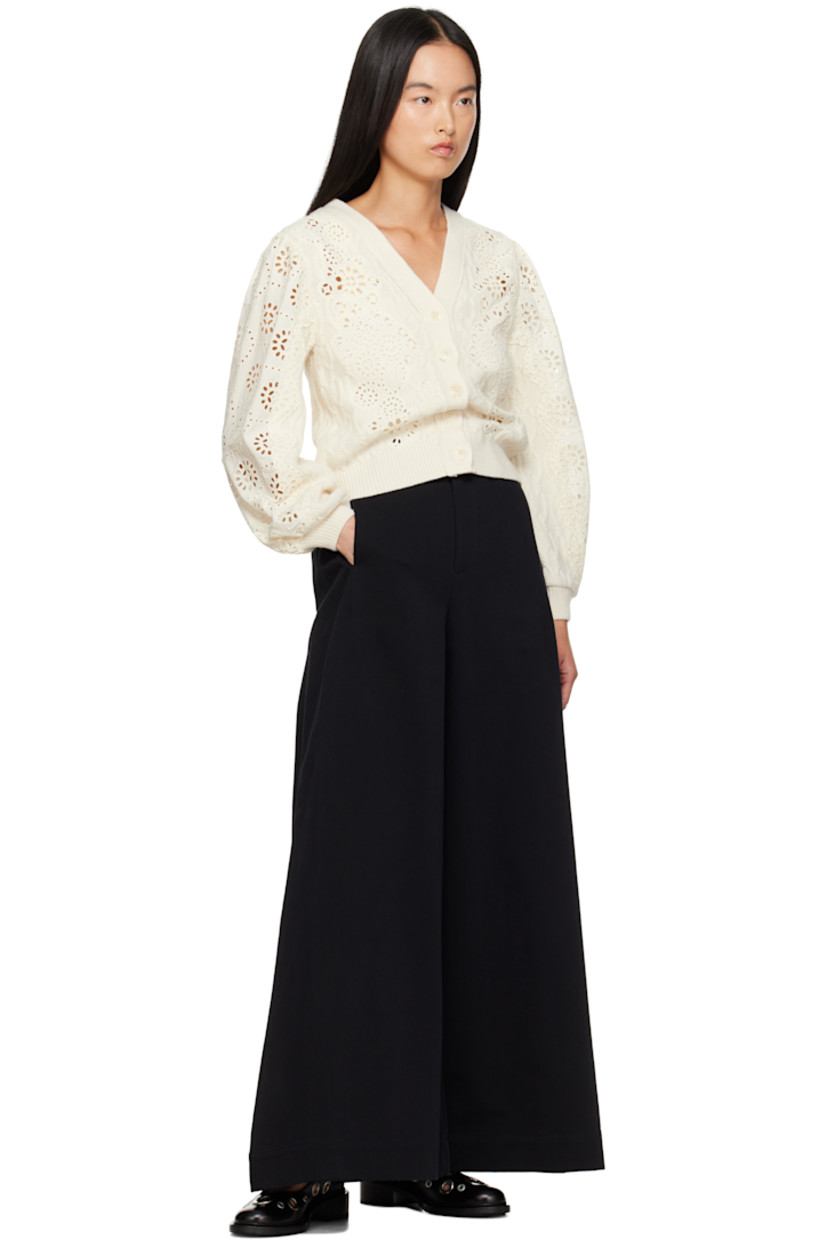 Relaxed-fit knit wool and cotton cardigan. Broderie anglaise detailing throughout.

· Rib-knit Y-neck, hem, and cuffs
· Button closure
· Balloon sleeves

Supplier color: Cream