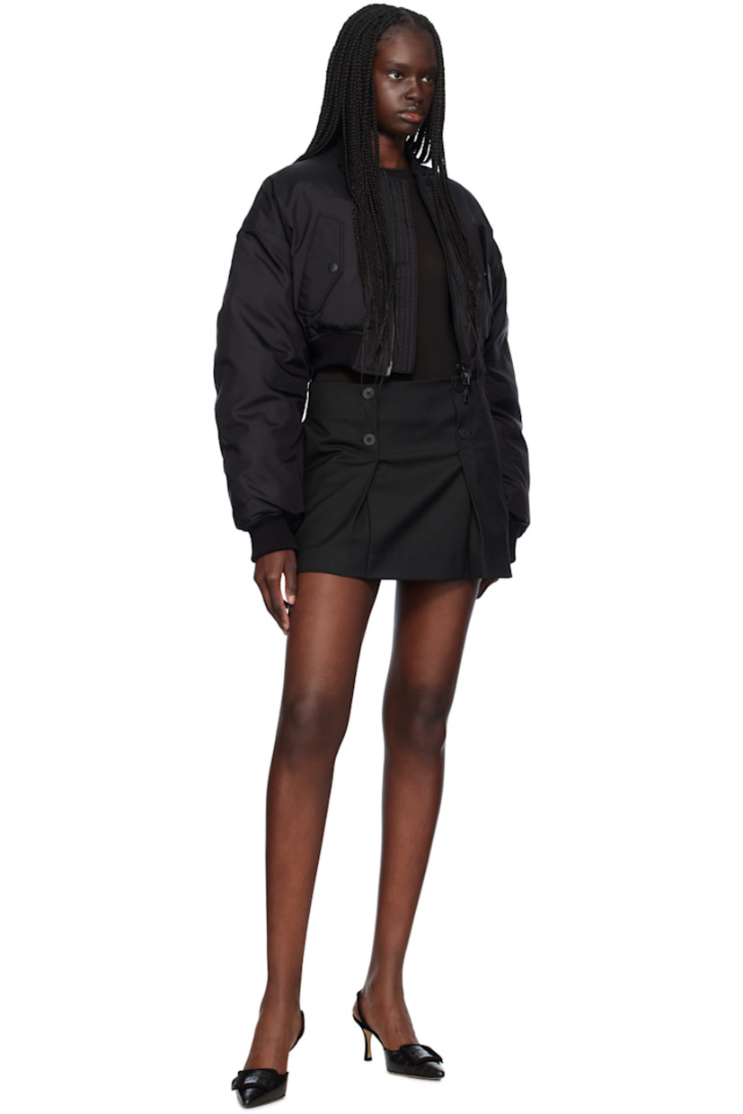 Reversible down-filled nylon canvas bomber jacket.

Reverse in black quilted nylon taffeta. 

· Rib knit stand collar, hem, and cuffs
· Two-way zip closure
· Flap pockets
· Cropped hem
· Dropped shoulders
· Zip pockets at interior

Supplier color: Black

Fill: 90% duck down, 10% feathers.