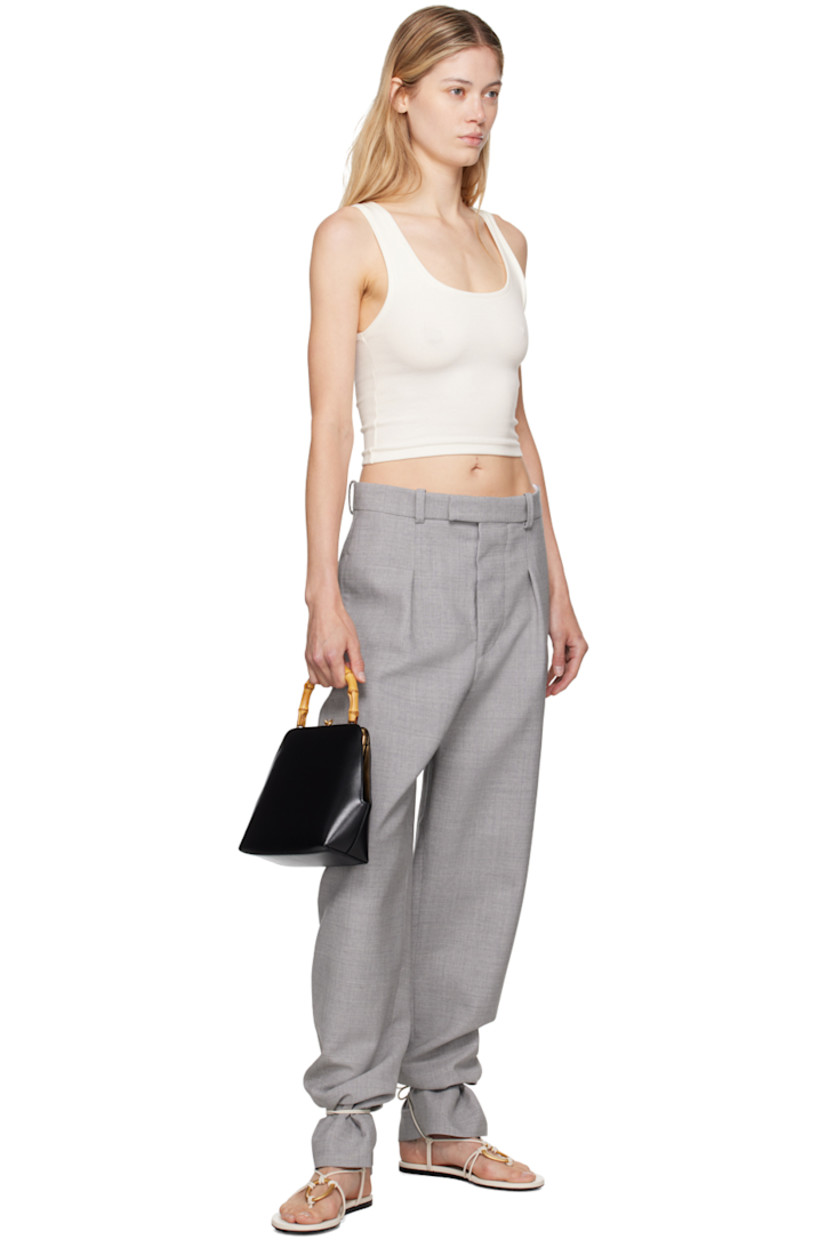 Wide-leg tapered bonded virgin wool crepe trousers.

· Low-rise
· Belt loops
· Three-pocket styling 
· Button-fly
· Pleats at front

Part of the WARDROBE.NYC x Hailey Bieber collaboration.

Supplier color: Grey marl