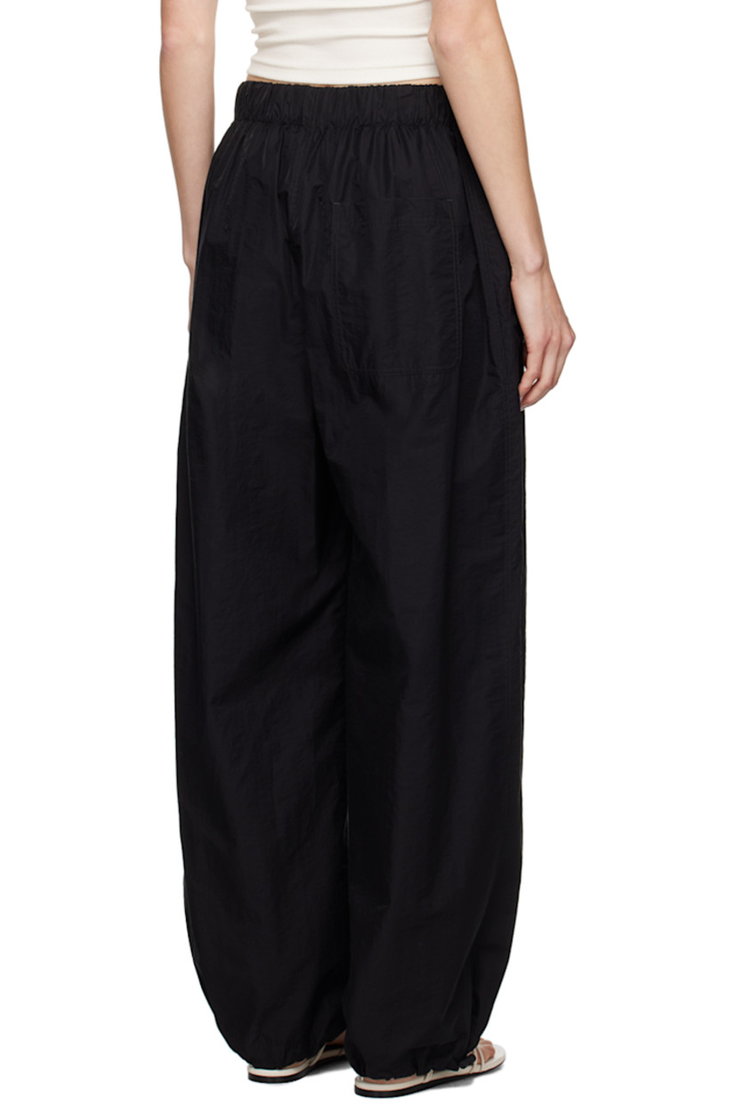 Cotton- and nylon-blend micro ripstop trousers.

· Concealed drawstring at elasticized waistband
· Three-pocket styling
· Mock-fly 
· Bungee-style drawstring at cuffs

Supplier color: Black