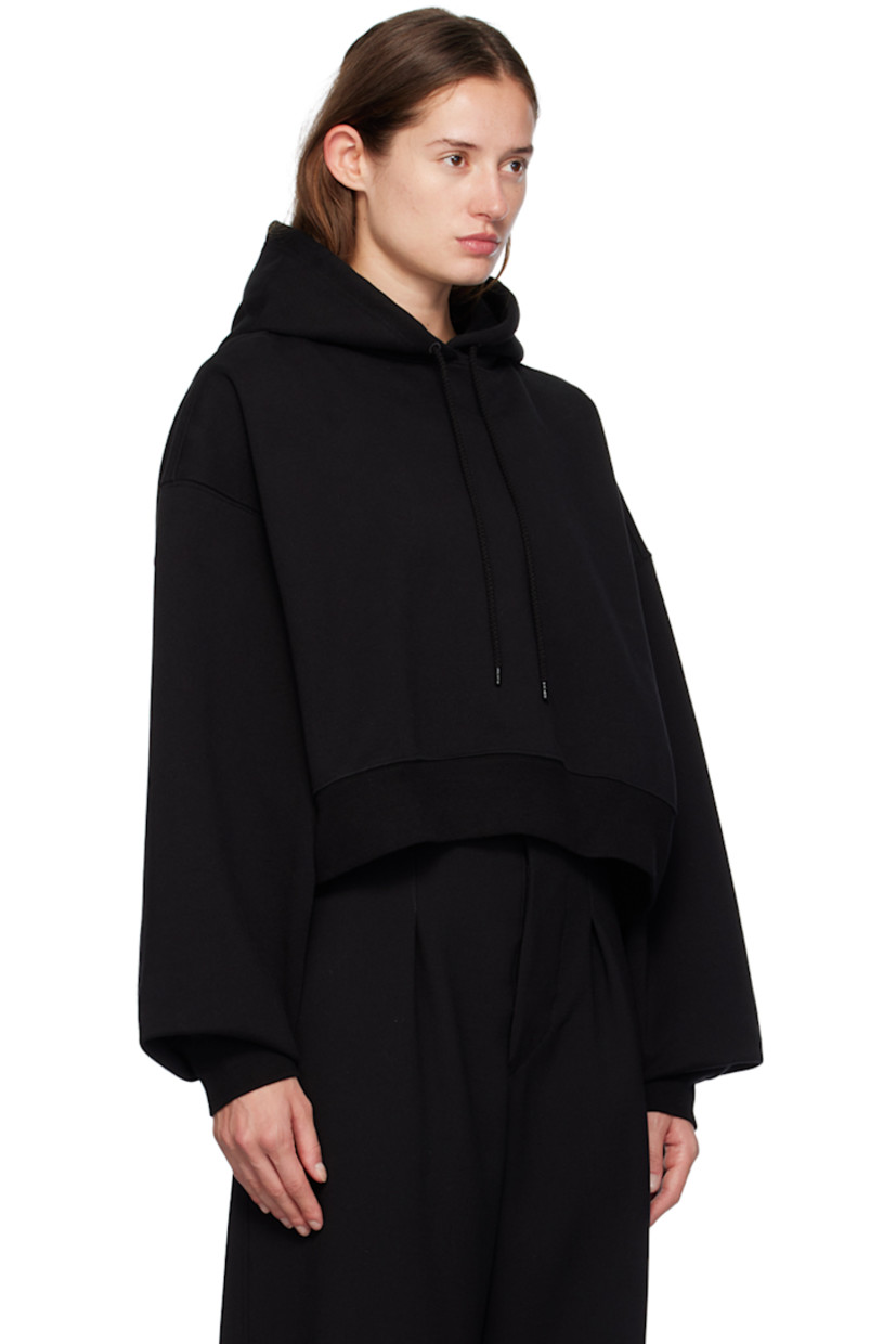 French terry hoodie.

· Drawstring at hood
· Rib knit hem and cuffs
· Dropped shoulders
· Extended sleeves

Supplier color: Black