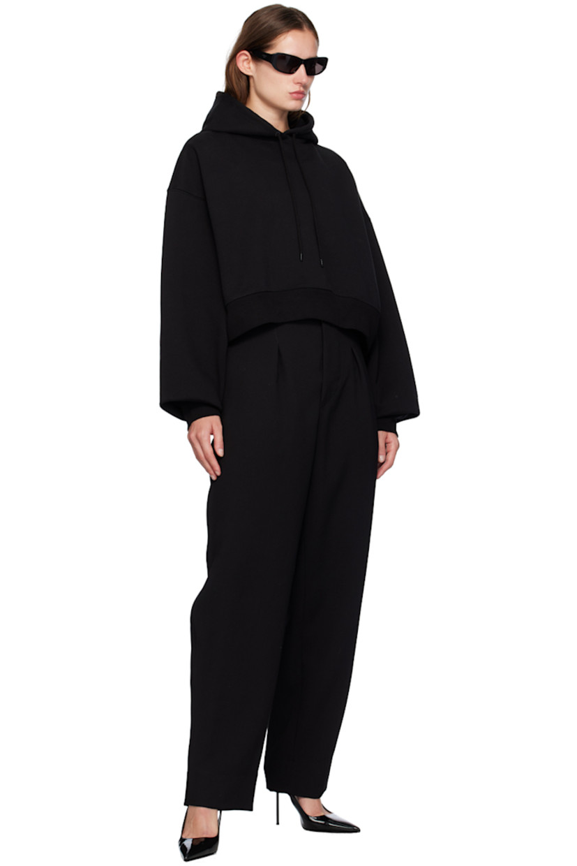 French terry hoodie.

· Drawstring at hood
· Rib knit hem and cuffs
· Dropped shoulders
· Extended sleeves

Supplier color: Black
