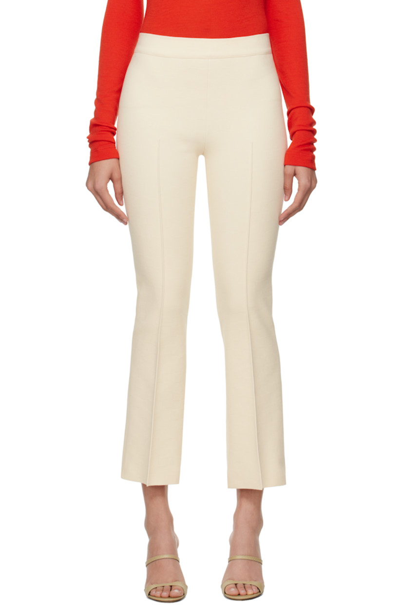 Flared knit stretch cotton-blend trousers. Subtle jacquard check pattern throughout.

· Elasticized waistband
· Pintuck at legs
· Cropped legs
· Mock welt pockets at back

Supplier color: Ivory