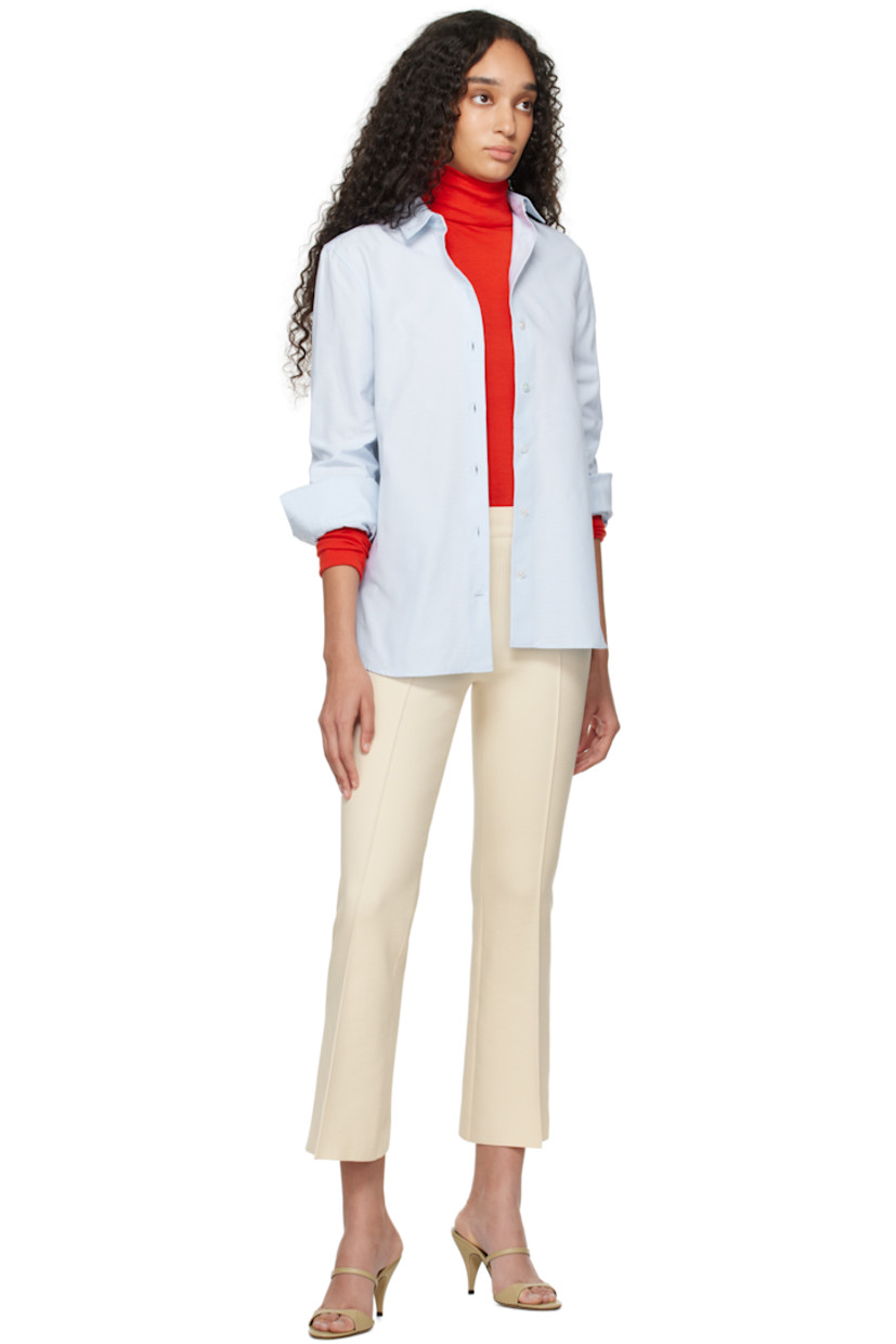 Flared knit stretch cotton-blend trousers. Subtle jacquard check pattern throughout.

· Elasticized waistband
· Pintuck at legs
· Cropped legs
· Mock welt pockets at back

Supplier color: Ivory