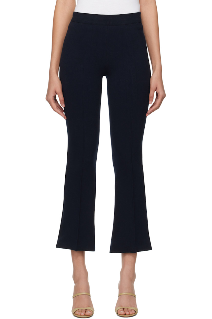 Flared knit stretch cotton-blend trousers. Subtle jacquard check pattern throughout.

· Elasticized waistband
· Pintuck at legs
· Cropped legs
· Mock welt pockets at back

Supplier color: Dark navy