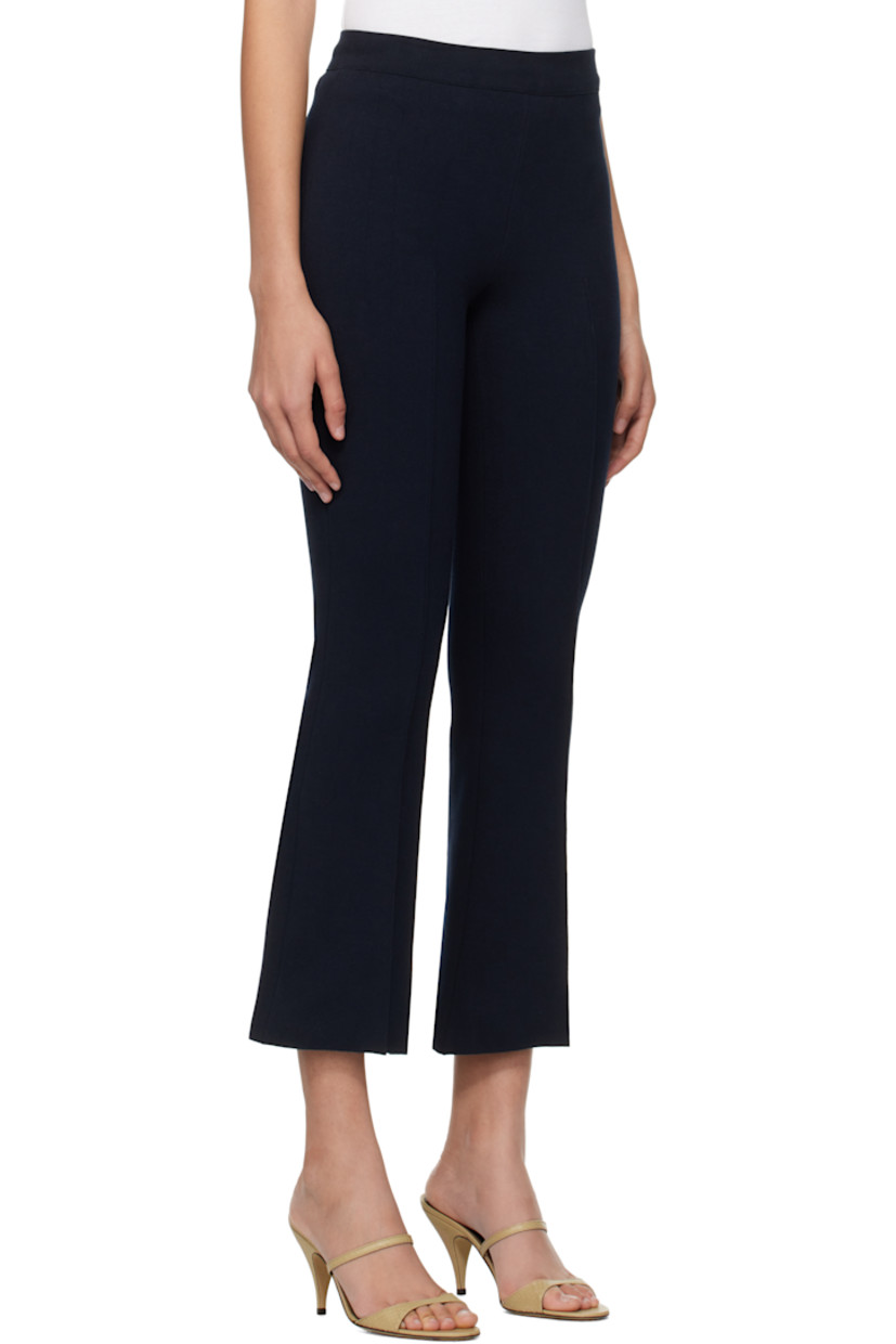 Flared knit stretch cotton-blend trousers. Subtle jacquard check pattern throughout.

· Elasticized waistband
· Pintuck at legs
· Cropped legs
· Mock welt pockets at back

Supplier color: Dark navy