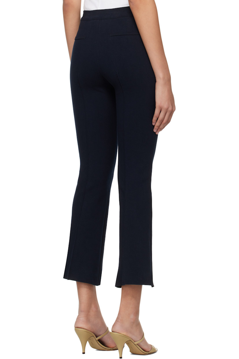 Flared knit stretch cotton-blend trousers. Subtle jacquard check pattern throughout.

· Elasticized waistband
· Pintuck at legs
· Cropped legs
· Mock welt pockets at back

Supplier color: Dark navy