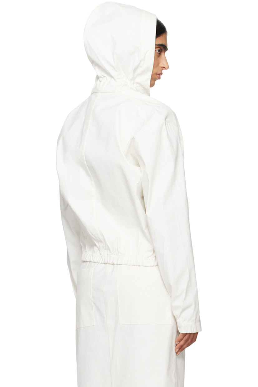 Handcrafted polyurethane-coated cotton twill jacket.

· Elasticized trim at hood 
· Two-way zip closure with press-stud fastening 
· Elasticized hem 
· Seam pockets
· Press-stud fastening at elasticized cuffs 
· Patch pockets at interior
· Unlined

Part of the Serie No.15 collection.

Supplier color: White