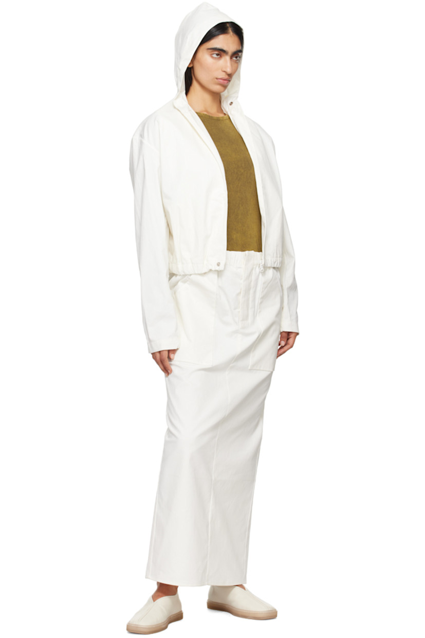 Handcrafted polyurethane-coated cotton twill jacket.

· Elasticized trim at hood 
· Two-way zip closure with press-stud fastening 
· Elasticized hem 
· Seam pockets
· Press-stud fastening at elasticized cuffs 
· Patch pockets at interior
· Unlined

Part of the Serie No.15 collection.

Supplier color: White