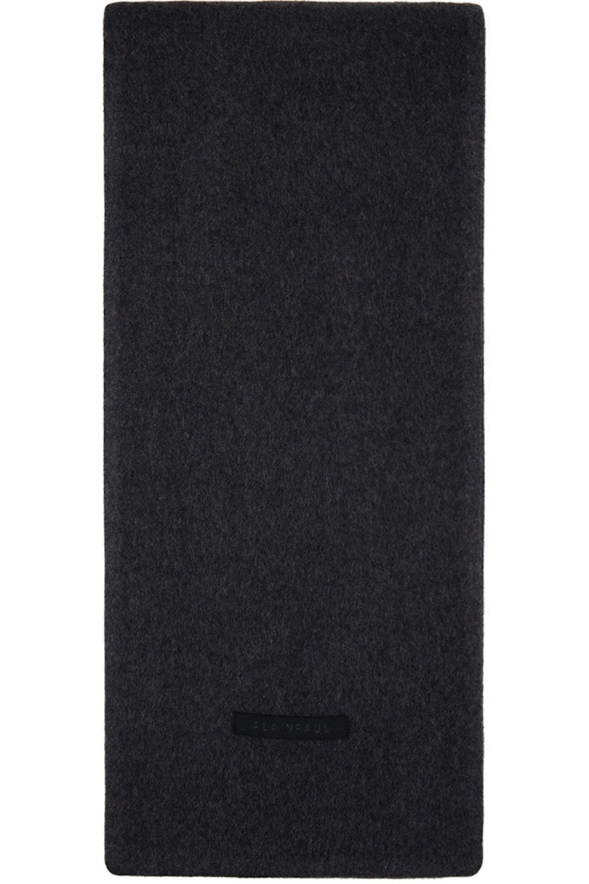 Double-faced wool melton scarf in gray.

· Mock welt pocket at face
· Flap pocket
· Button hardware at ends
· Logo patch at back face
· Logo-woven satin pocket lining 

Supplier color: Grey