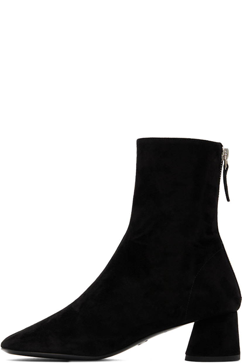 Ankle-high goatskin suede boots in black.

· Zip closure at heel
· Grained leather lining
· Covered cylindrical heel with rubber injection
· Logo hardware at polished calfskin sole
· Heel: H2"

Supplier color: Black