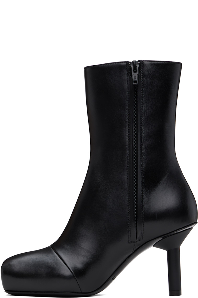 Ankle-high buffed leather boots in black.

· Square toe
· Zip closure at inner side
· Buffed leather lining
· Rubber stiletto heel
· Patent leather sole
· Heel: H3"

Supplier color: Black
