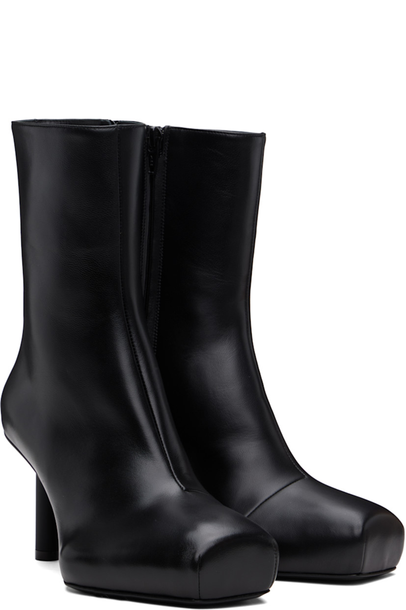 Ankle-high buffed leather boots in black.

· Square toe
· Zip closure at inner side
· Buffed leather lining
· Rubber stiletto heel
· Patent leather sole
· Heel: H3"

Supplier color: Black