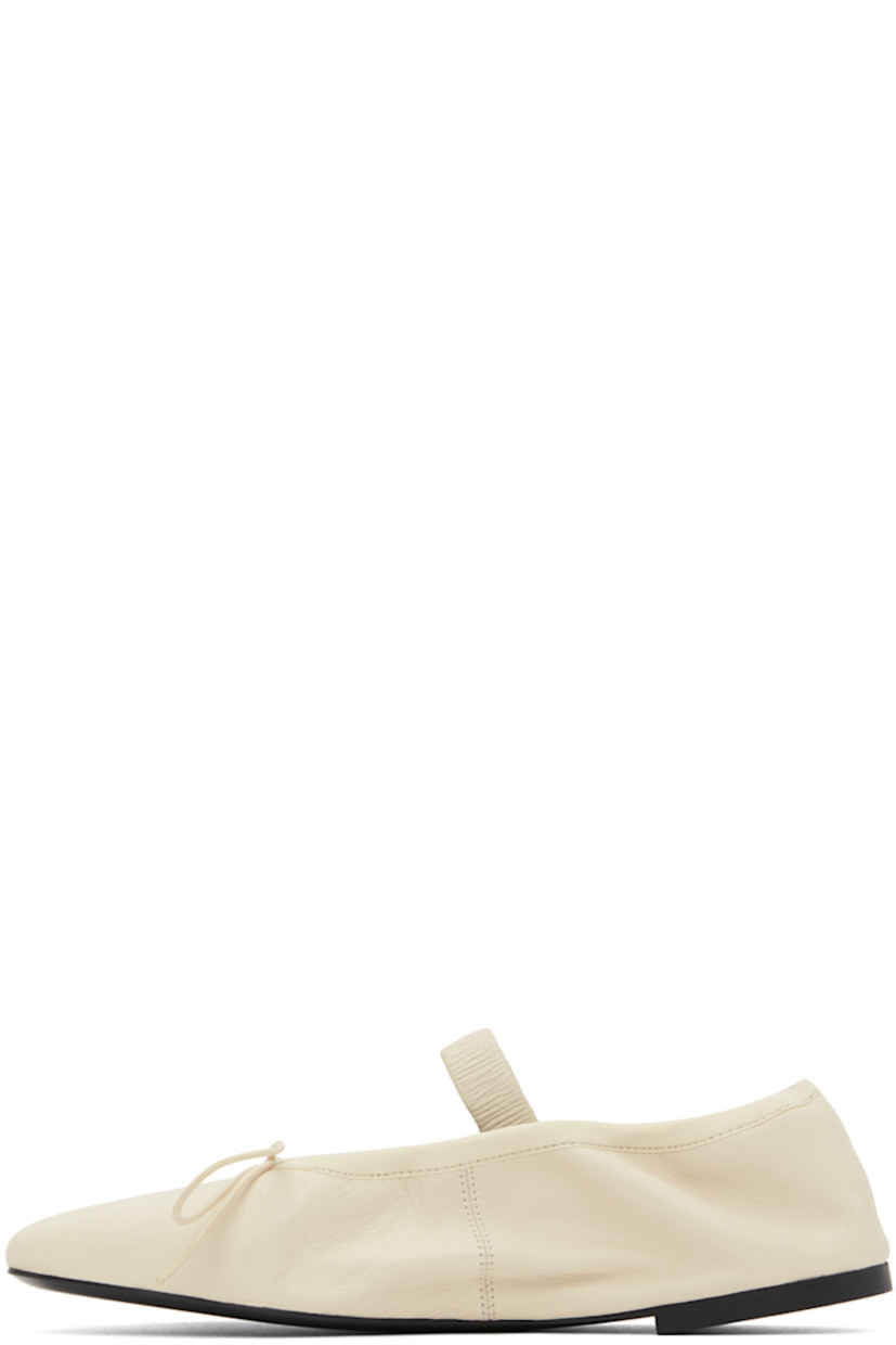 Crinkled leather Mary Jane-style ballerina flats in off-white.

· Self-tie bow accent at vamp
· Elasticized strap and collar
· Logo embossed at grained leather footbed
· Grained leather lining
· Rubber sole

Supplier color: Natural