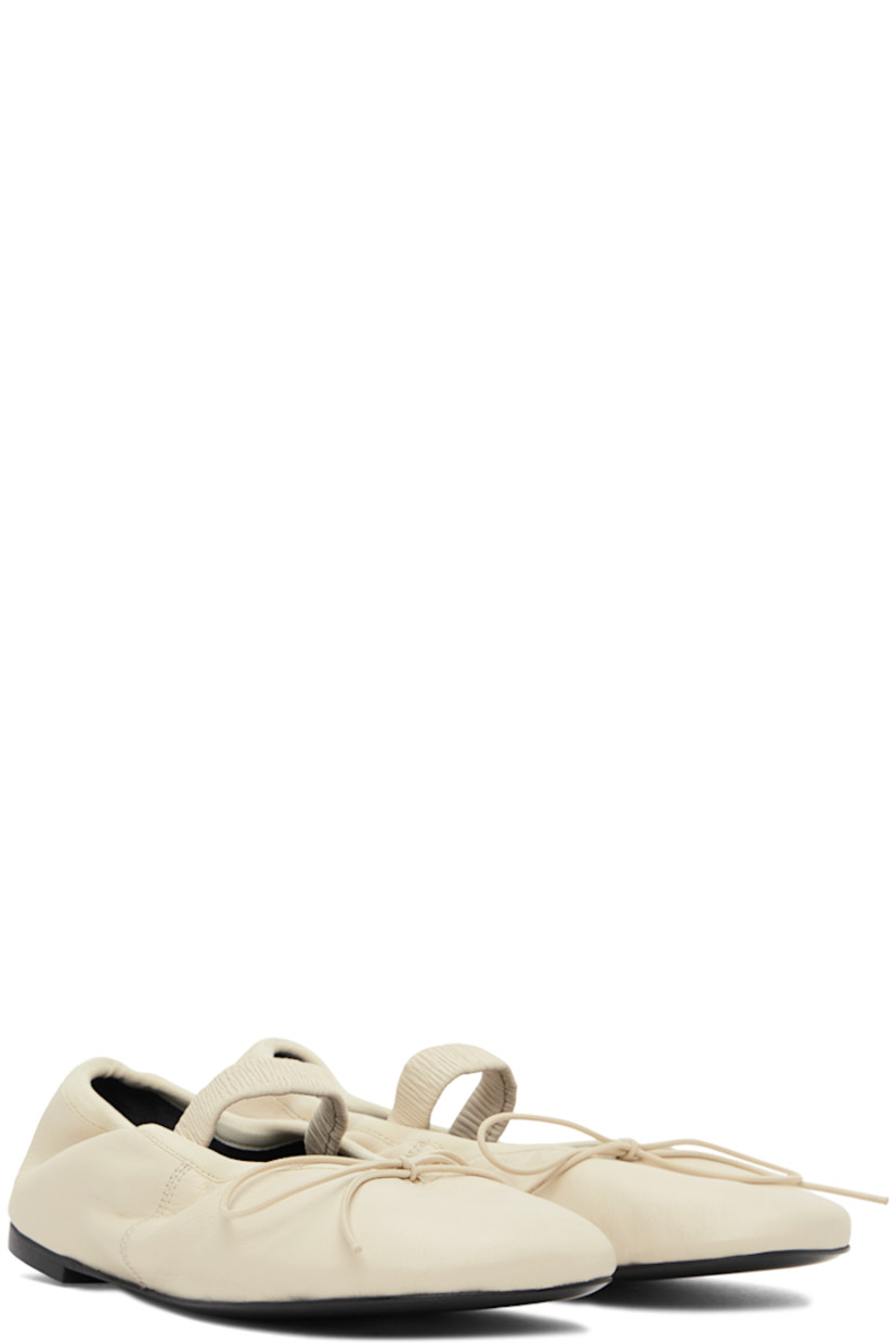 Crinkled leather Mary Jane-style ballerina flats in off-white.

· Self-tie bow accent at vamp
· Elasticized strap and collar
· Logo embossed at grained leather footbed
· Grained leather lining
· Rubber sole

Supplier color: Natural