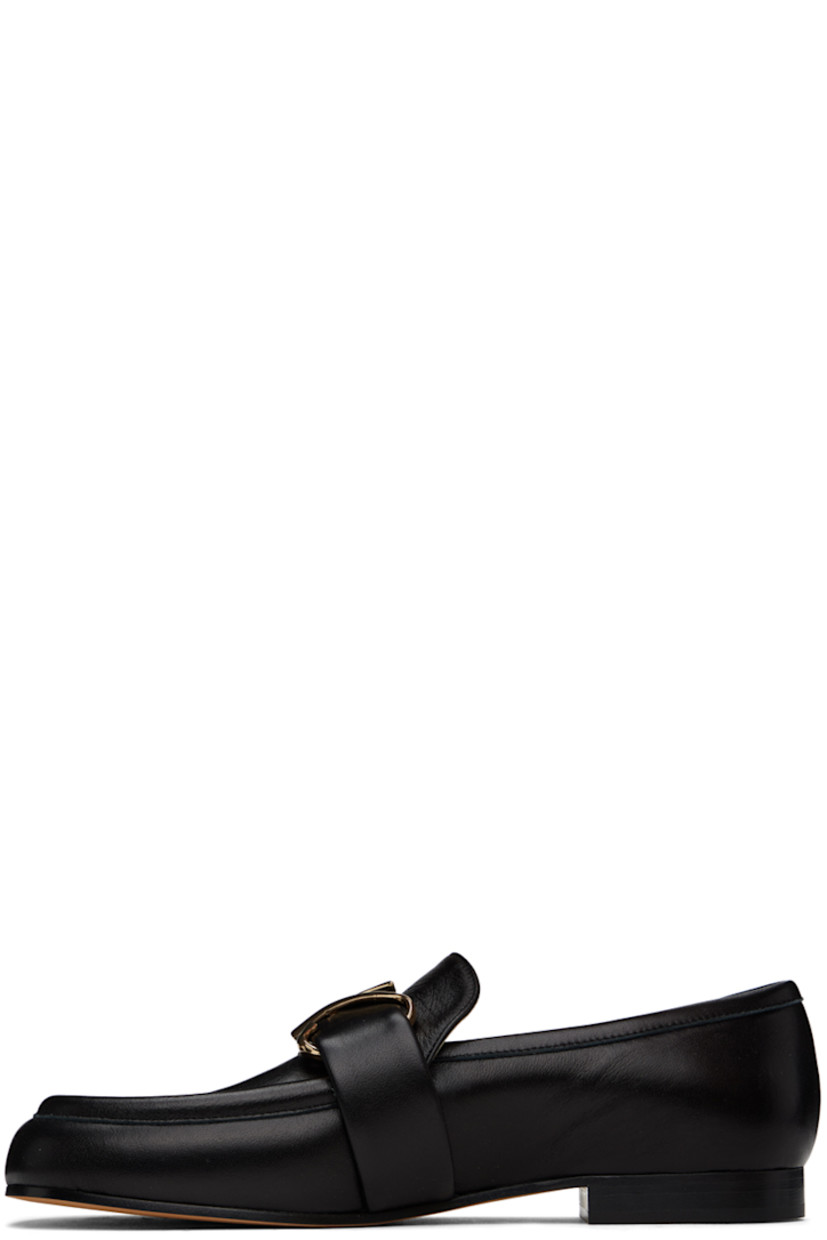 Buffed calfskin loafers in black.

· Strap and logo hardware at vamp
· Buffed calfskin lining
· Stacked leather heel with rubber injection
· Leather sole

Supplier color: Black