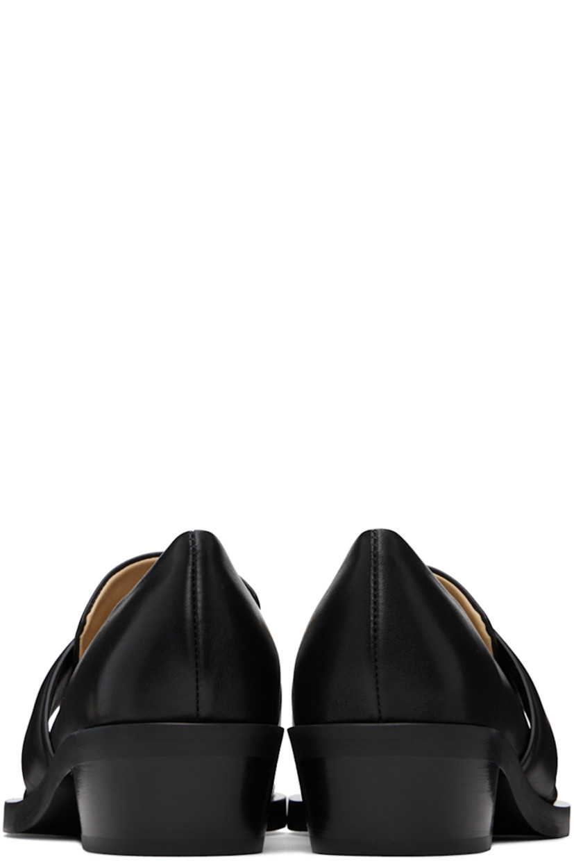 Buffed calfskin loafers in black. 

· Pointed square toe
· Strap at vamp
· Buffed leather and suede lining
· Stacked leather cylindrical heel with rubber injection
· Leather sole
· Heel: H1.5"

Supplier color: Black