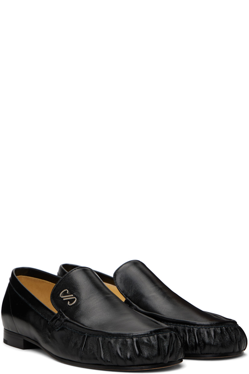 Buffed lambskin loafers in black.

· Pintucks at moc toe
· Silver-tone logo hardware at tongue
· Logo stamp at leather footbed
· Leather and suede lining
· Leather sole

Supplier color: Black