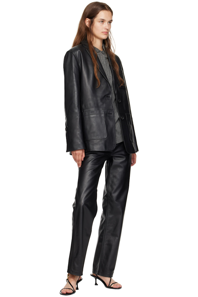 Buffed lambskin heeled sandals in black. 

· Open toe
· Criss-crossing straps at vamp
· Graphic hardware at vamp
· Slingback strap
· Logo stamp at padded footbed
· Grained leather lining
· Spool heel with rubber injection
· Patent leather sole
· Heel: H2.75"

Supplier color: Black