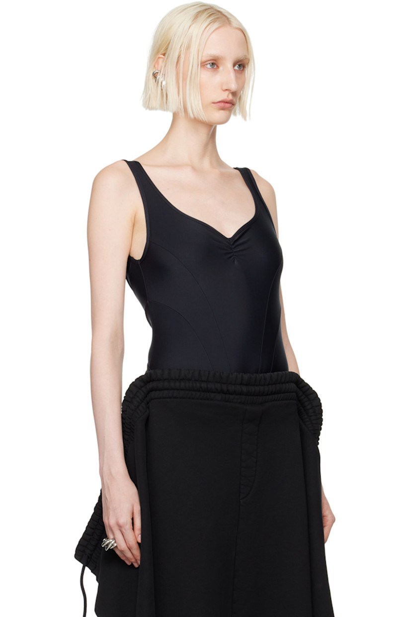Stretch nylon jersey bodysuit. 

· Paneled construction 
· Scoop neck
· Press-stud fastening at bottom
· Ruching at chest and back
· Logo embroidered at low back 
· Unlined

Supplier color: Black
