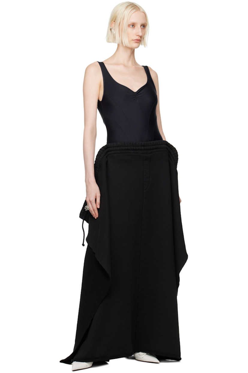Stretch nylon jersey bodysuit. 

· Paneled construction 
· Scoop neck
· Press-stud fastening at bottom
· Ruching at chest and back
· Logo embroidered at low back 
· Unlined

Supplier color: Black