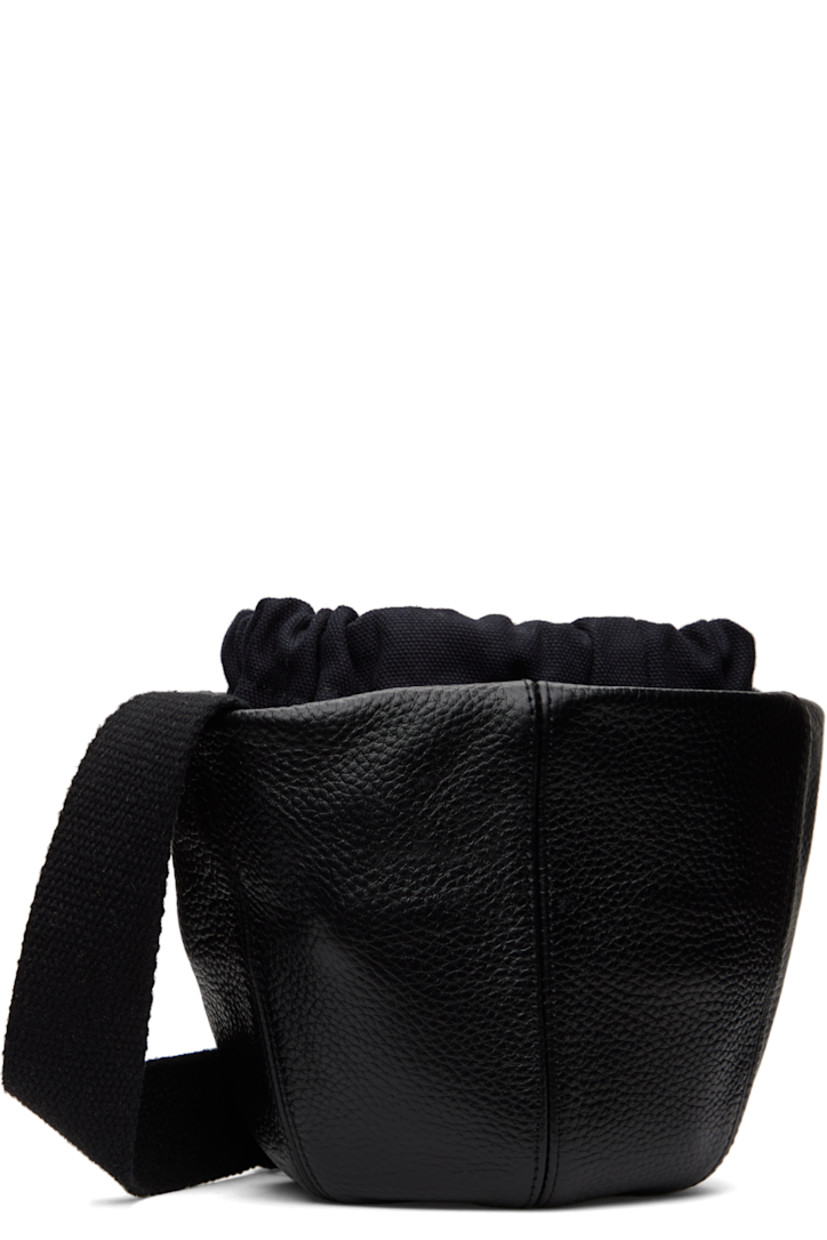 Pebble grained leather messenger bag in black.

· Adjustable crossbody strap
· Drawstring at throat
· Exposed canvas lining 
· H6.5" x W10" x D3"

Supplier color: Black
