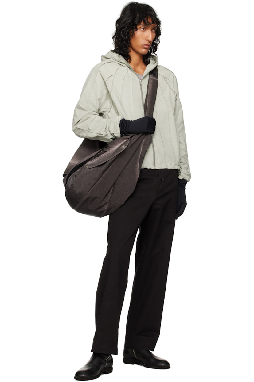 Cotton canvas jacket. Pinched seams throughout. 

· Funnel neck
· Zip closure
· Seam pockets
· Bungee-style drawstring at hem and cuffs
· Raglan sleeve

Supplier color: Laurel oak