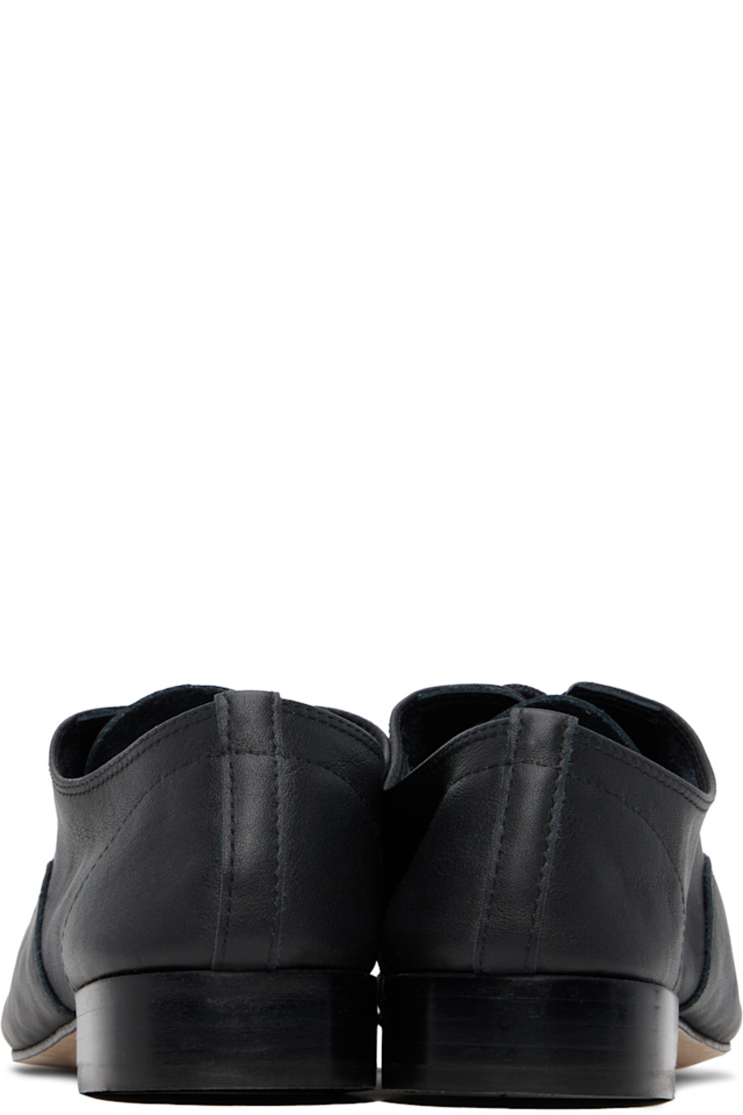Grained calfskin oxfords in black. 

· Lace-up closure
· Partial suede lining
· Stacked leather heel with rubber injection
· Nubuck sole
· Heel: H1.25"

Supplier color: Noir