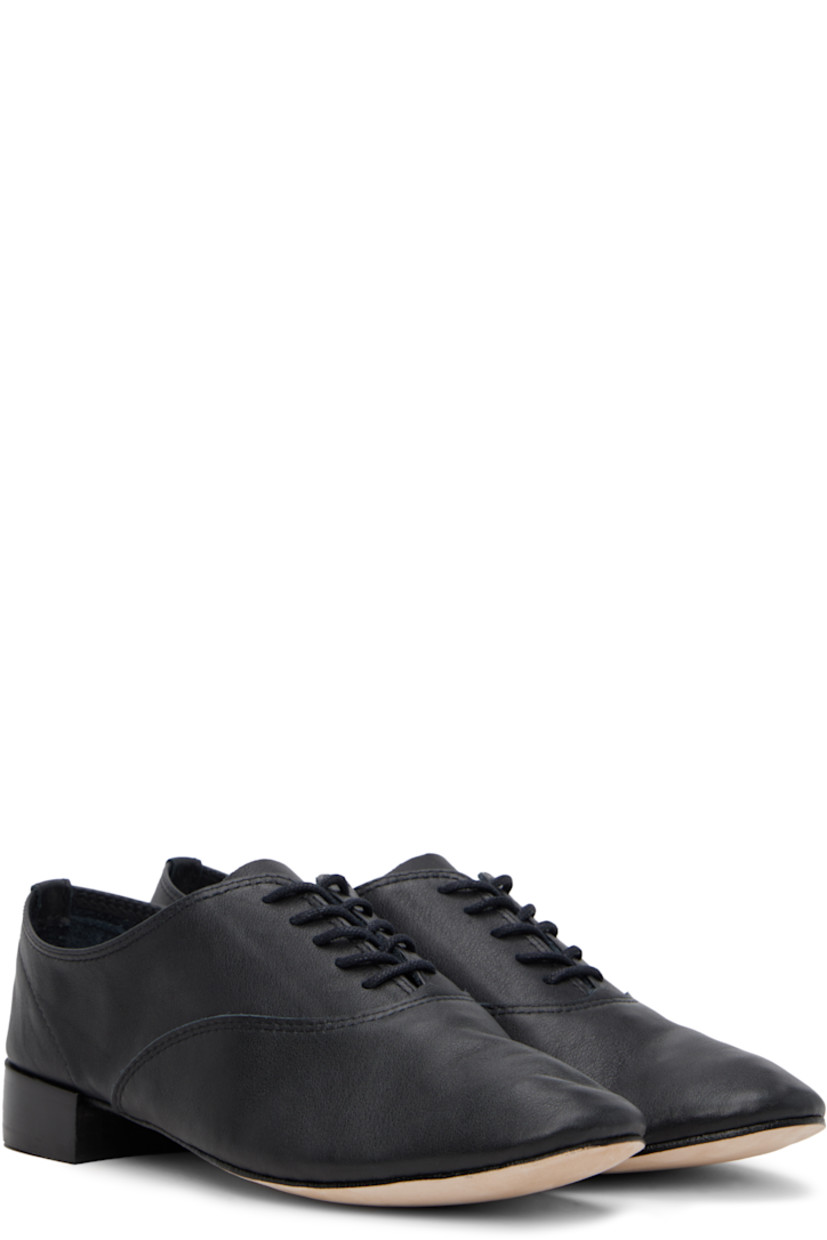 Grained calfskin oxfords in black. 

· Lace-up closure
· Partial suede lining
· Stacked leather heel with rubber injection
· Nubuck sole
· Heel: H1.25"

Supplier color: Noir