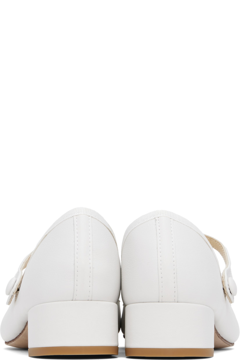 Grained nappa calfskin Mary Jane-style heels in white. 

· Partially elasticized strap at vamp
· Grosgrain trim at collar
· Twill lining
· Covered block heel with rubber injection
· Nubuck sole
· Heel: H1.5"

Supplier color: White