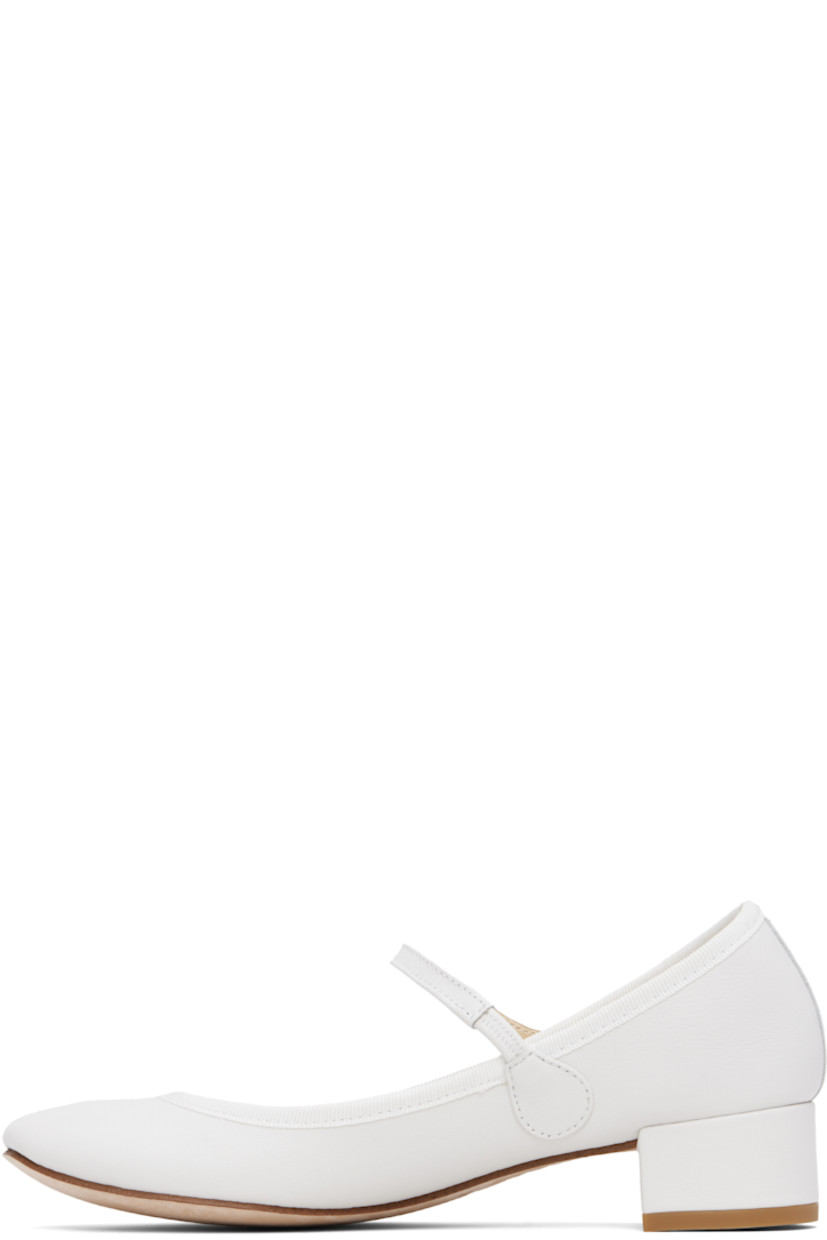 Grained nappa calfskin Mary Jane-style heels in white. 

· Partially elasticized strap at vamp
· Grosgrain trim at collar
· Twill lining
· Covered block heel with rubber injection
· Nubuck sole
· Heel: H1.5"

Supplier color: White