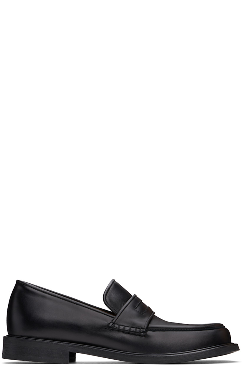 Buffed leather loafers in black.

· Moc toe
· Strap at vamp
· Cushioned Ortholite® footbed
· Buffed leather and suede lining
· Stacked leather heel and midsole
· Textured Vibram® rubber sole
· Heel: H1"

Supplier color: Black
