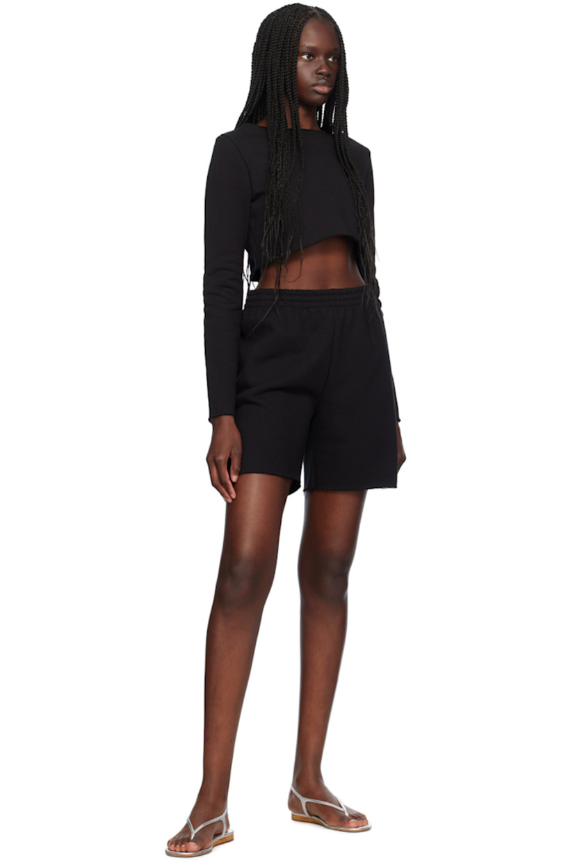 Cotton fleece shorts. 

· Concealed drawstring at elasticized waistband
· Single-pocket styling
· Raw edge at cuffs

Supplier color: Black