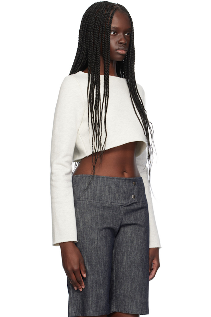 Cotton fleece sweatshirt. Raw edge at boat neck, cropped hem, and cuffs. 

Supplier color: Ash gray