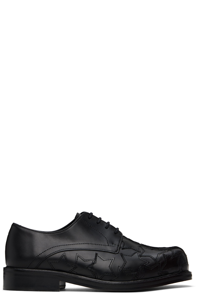 Buffed leather derbys in black. 

· Square toe
· Graphic appliqués at vamp 
· Lace-up closure
· Logo embossed at padded leather footbed
· Buffed leather and suede lining
· Stacked leather heel with rubber injection 
· Leather sole

Supplier color: Black