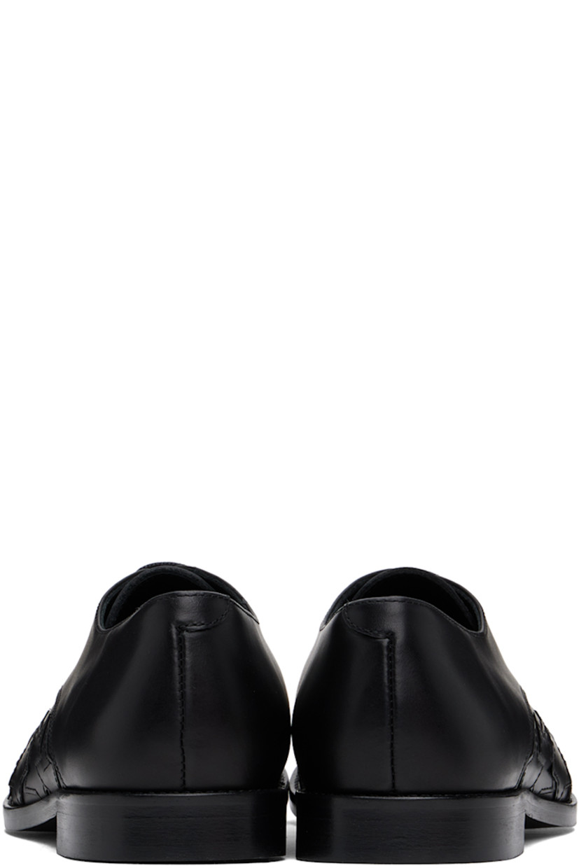 Polished leather derbys in black.

· Graphic appliqués at toe and sides
· Lace-up closure
· Logo embossed at padded insole
· Buffed leather and suede lining
· Stacked leather block heel 
· Polished leather sole with rubber injections

Supplier color: Black
