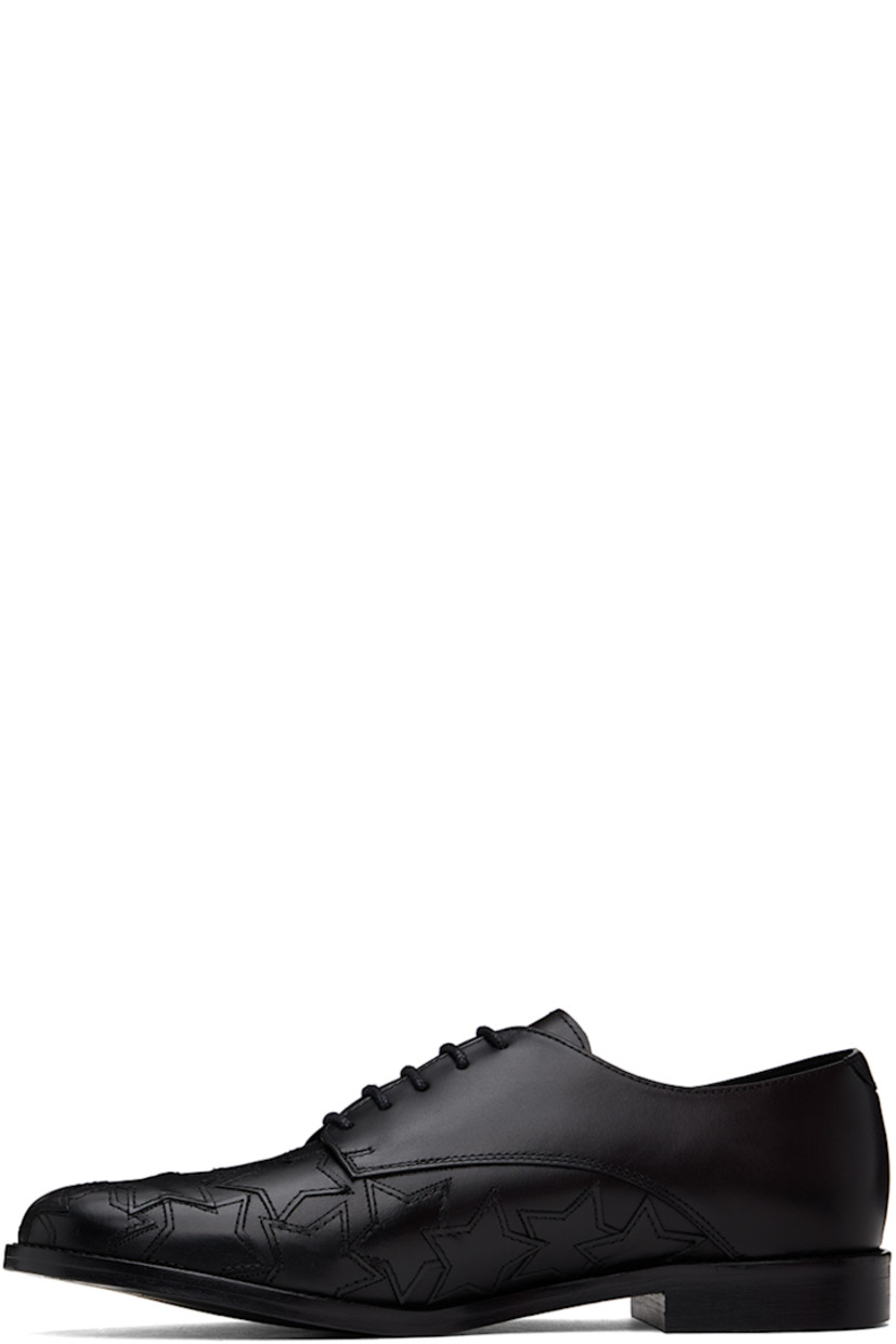Polished leather derbys in black.

· Graphic appliqués at toe and sides
· Lace-up closure
· Logo embossed at padded insole
· Buffed leather and suede lining
· Stacked leather block heel 
· Polished leather sole with rubber injections

Supplier color: Black