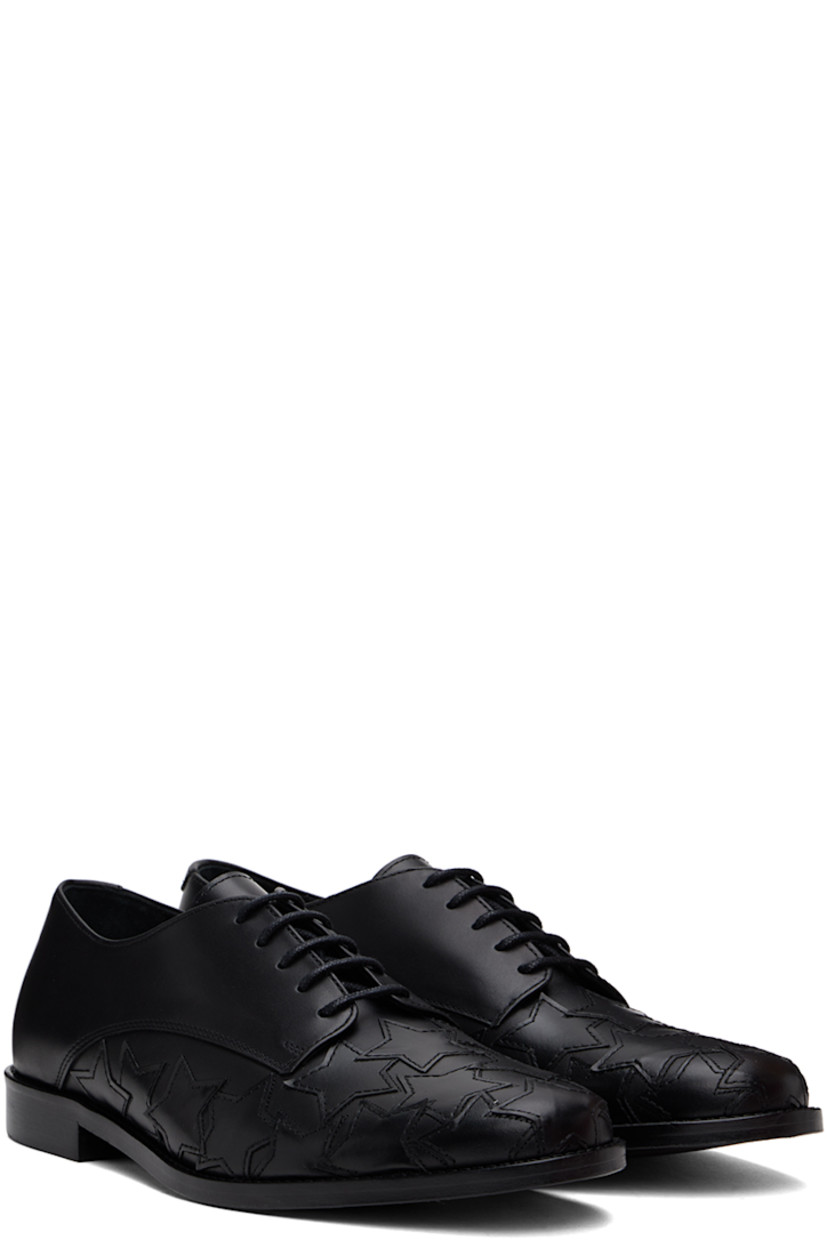 Polished leather derbys in black.

· Graphic appliqués at toe and sides
· Lace-up closure
· Logo embossed at padded insole
· Buffed leather and suede lining
· Stacked leather block heel 
· Polished leather sole with rubber injections

Supplier color: Black