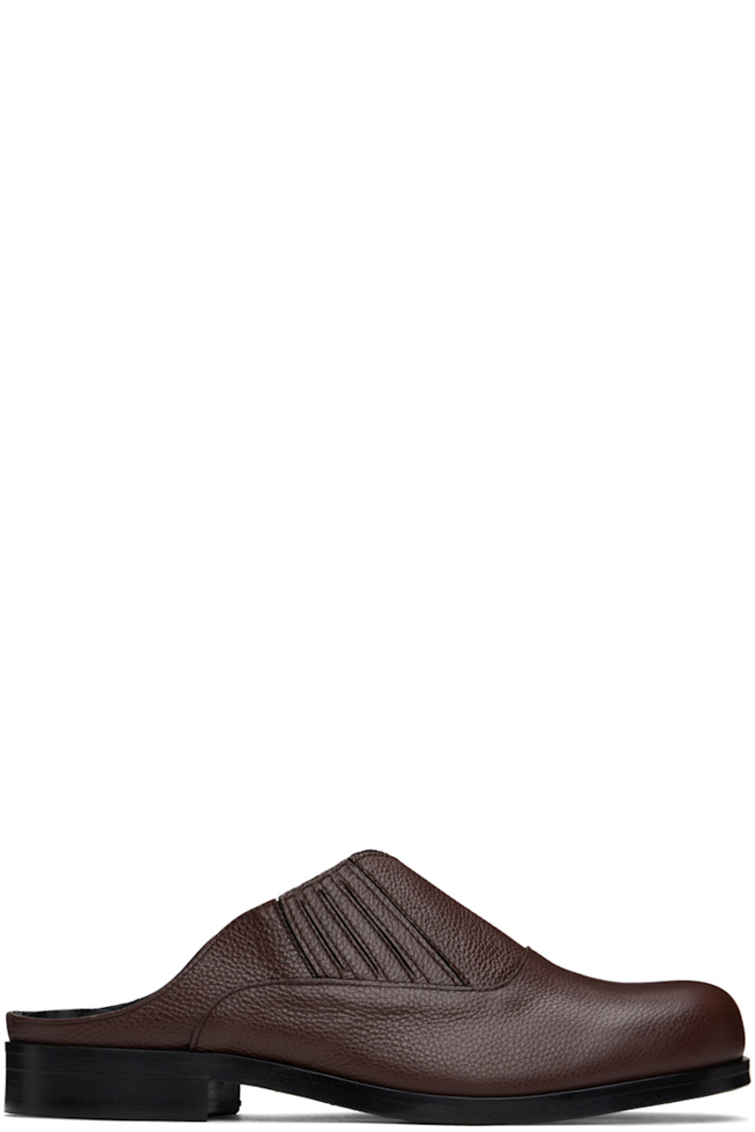 Grained leather slip-on loafers in brown.

· Concealed elasticized gusset at sides
· Logo embossed at padded leather footbed
· Leather lining
· Stacked block heel with rubber injection
· Polished leather sole

Available exclusively at SSENSE.

Supplier color: Brown/Brown