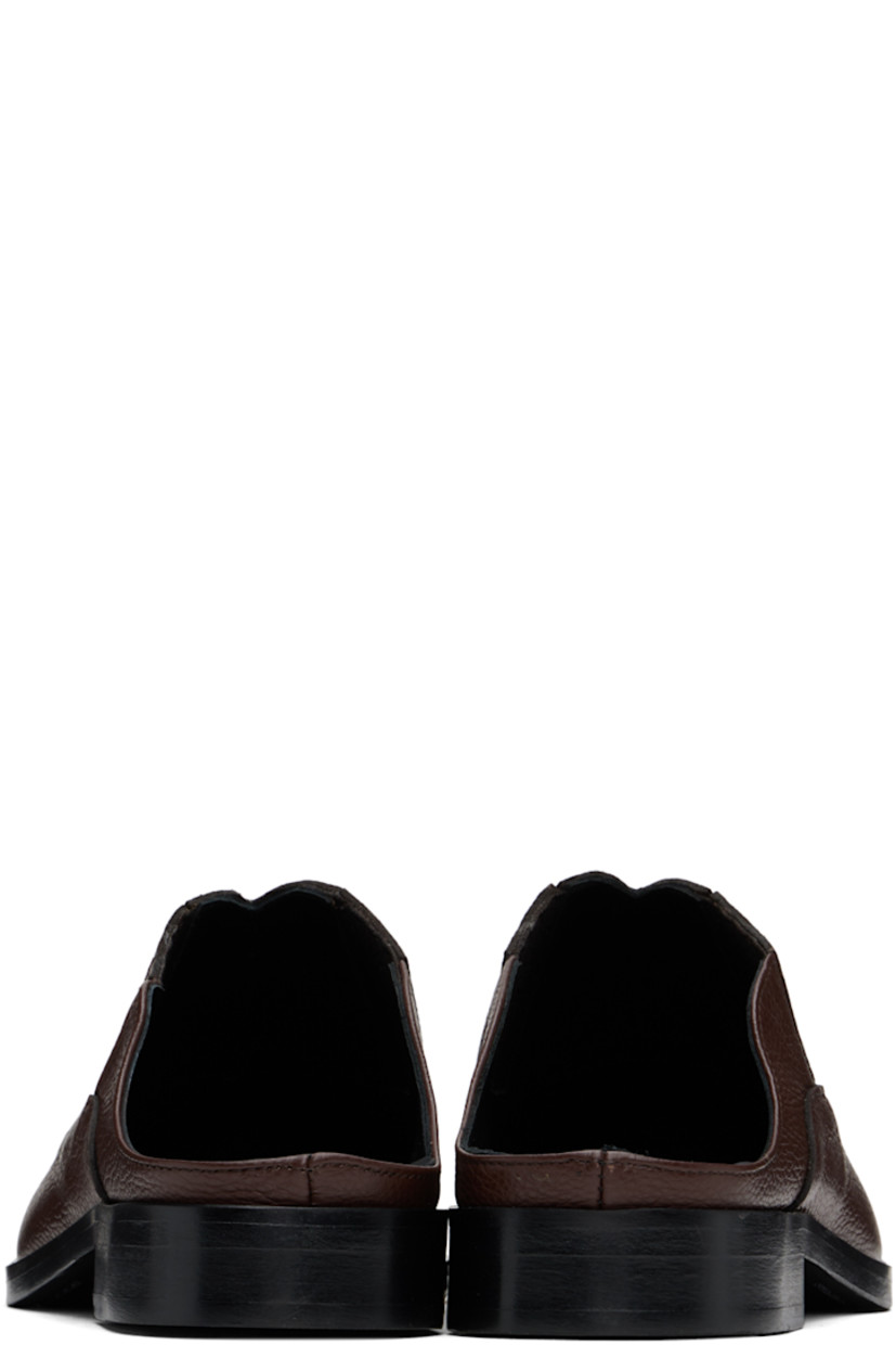 Grained leather slip-on loafers in brown.

· Concealed elasticized gusset at sides
· Logo embossed at padded leather footbed
· Leather lining
· Stacked block heel with rubber injection
· Polished leather sole

Available exclusively at SSENSE.

Supplier color: Brown/Brown