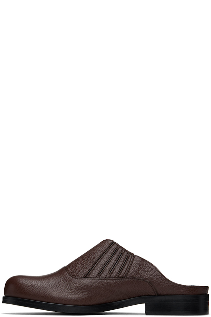 Grained leather slip-on loafers in brown.

· Concealed elasticized gusset at sides
· Logo embossed at padded leather footbed
· Leather lining
· Stacked block heel with rubber injection
· Polished leather sole

Available exclusively at SSENSE.

Supplier color: Brown/Brown
