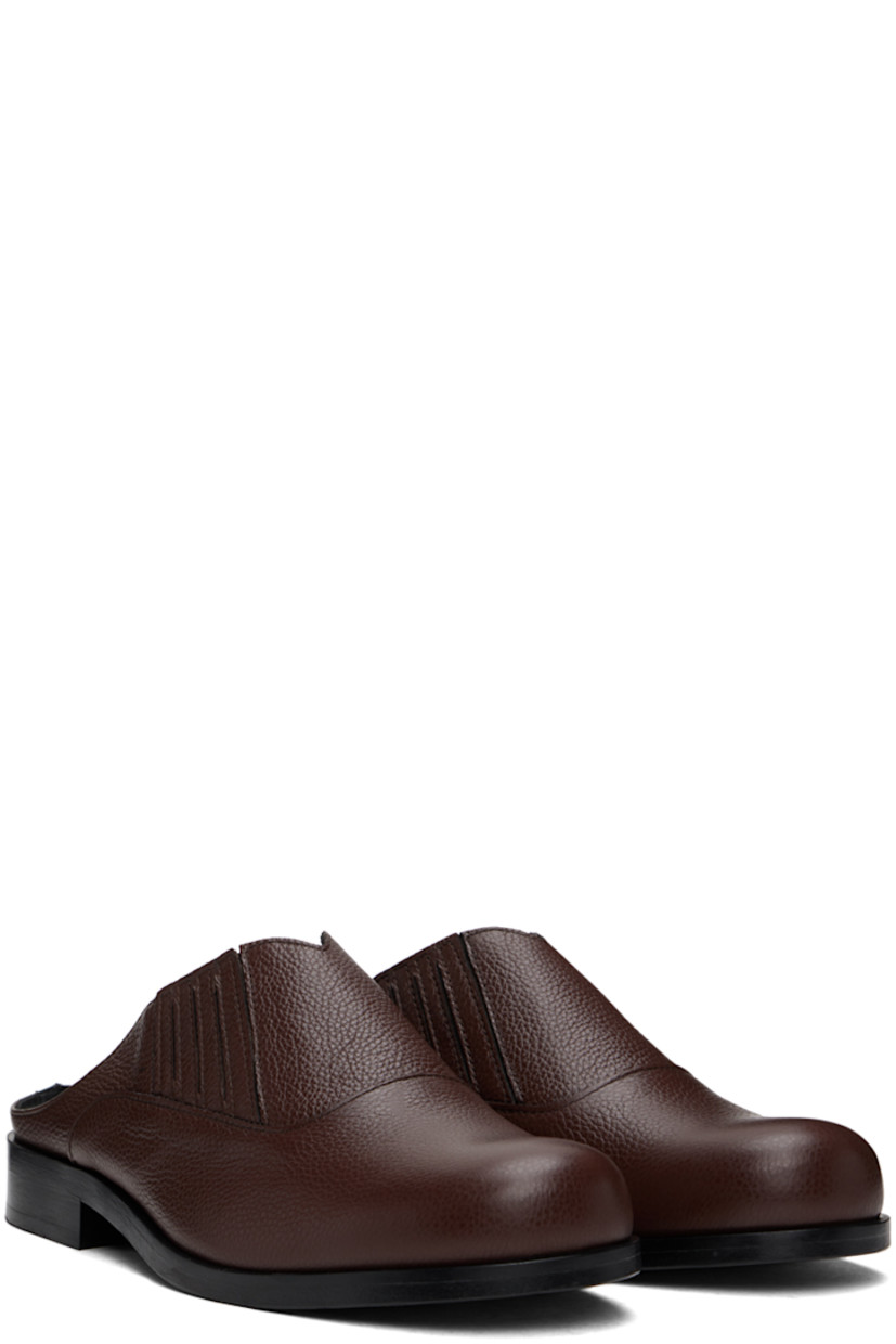 Grained leather slip-on loafers in brown.

· Concealed elasticized gusset at sides
· Logo embossed at padded leather footbed
· Leather lining
· Stacked block heel with rubber injection
· Polished leather sole

Available exclusively at SSENSE.

Supplier color: Brown/Brown