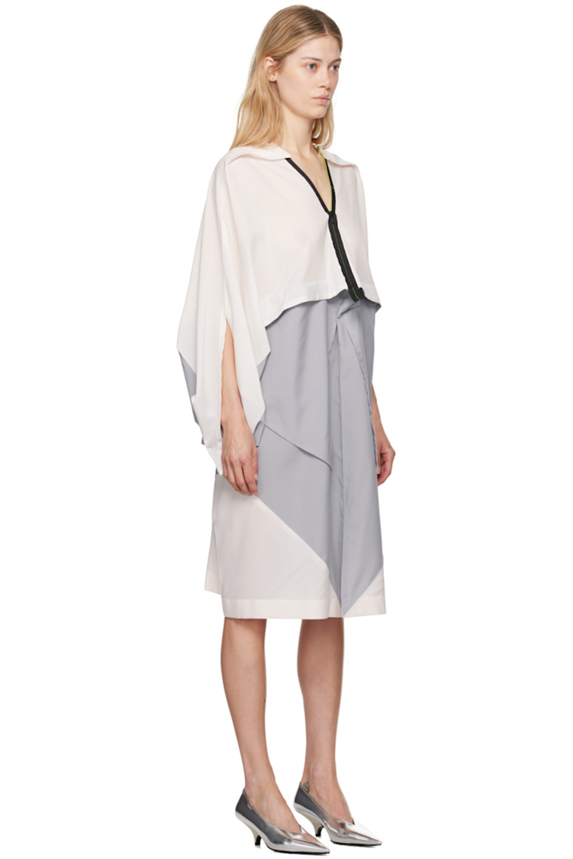Polyester chiffon dress. Pinched seams throughout.

· Draped construction
· V-neck
· Zip closure
· Patch pockets
· Slit at front hem

Supplier color: Light gray/Off-white