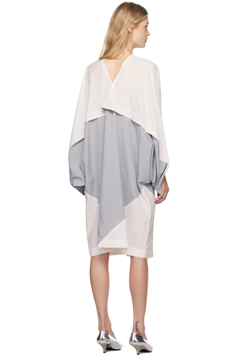 Polyester chiffon dress. Pinched seams throughout.

· Draped construction
· V-neck
· Zip closure
· Patch pockets
· Slit at front hem

Supplier color: Light gray/Off-white